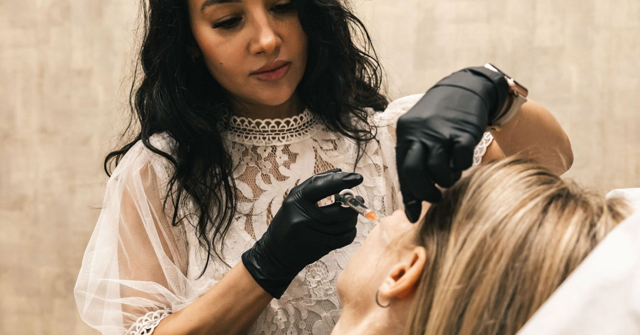 Woman getting a filler treatment in cheek