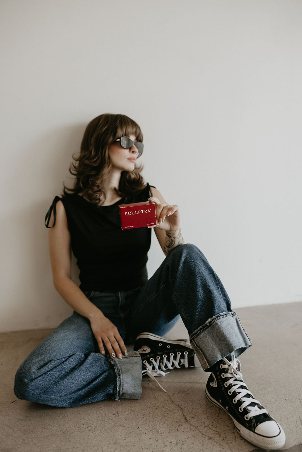 TBL Team member holding a box of Sculptra